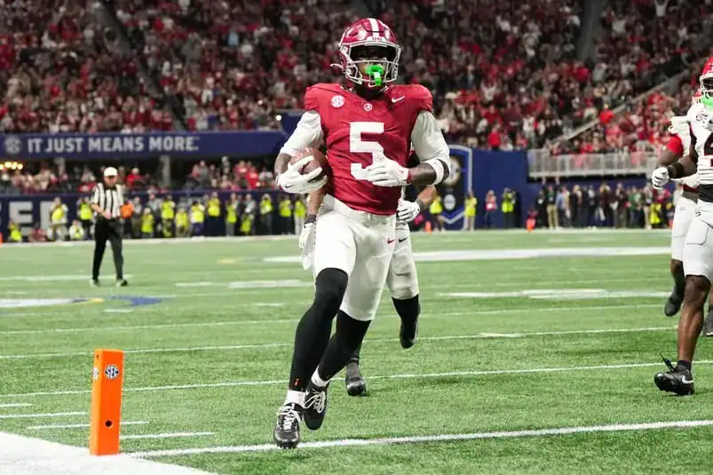 Alabama Crimson Tide wide receiver Germie Bernard (5) scores a touchdown during the fourth quarter against the Georgia Bulldogs during the 2025 SEC Championship game at Mercedes-Benz Stadium. Mandatory Credit: Dale Zanine-Imagn Images