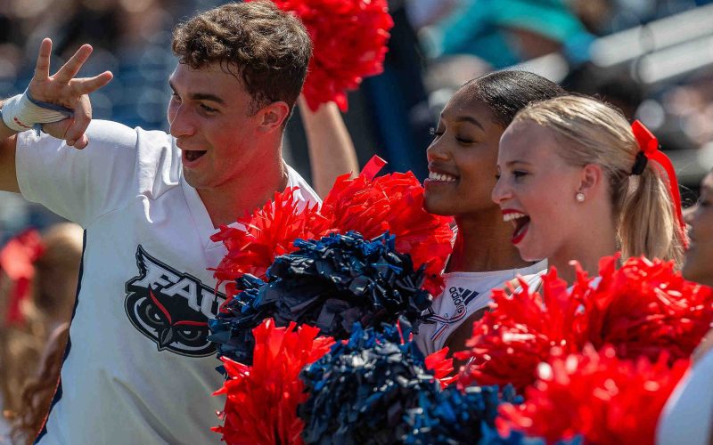 FAU cheerleader pose for television cameras during NCAA college football action as the Florida Atlantic University Owls host Army\'s Black Knights on September 7, 2024, in Boca Raton, Fla. Army won the contest.