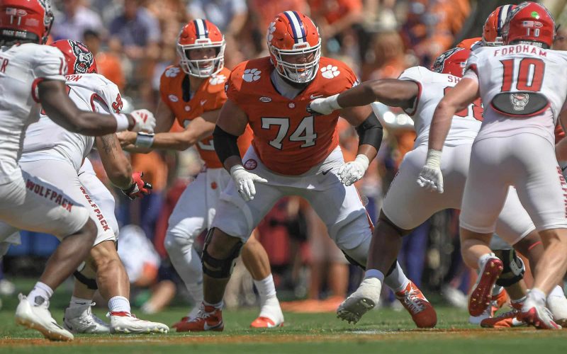 Sep 21, 2024; Clemson, South Carolina, USA; Clemson Tigers offensive lineman Marcus Tate (74) blocks for quarterback Cade Klubnik (2) against the North Carolina State Wolfpack during the second quarter at Memorial Stadium. Mandatory Credit: Ken Ruinard-Imagn Images