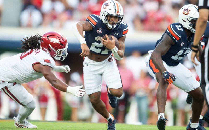 Auburn Tiger Jarquez Hunter runs the ball against the Arkansas Razorbacks.
