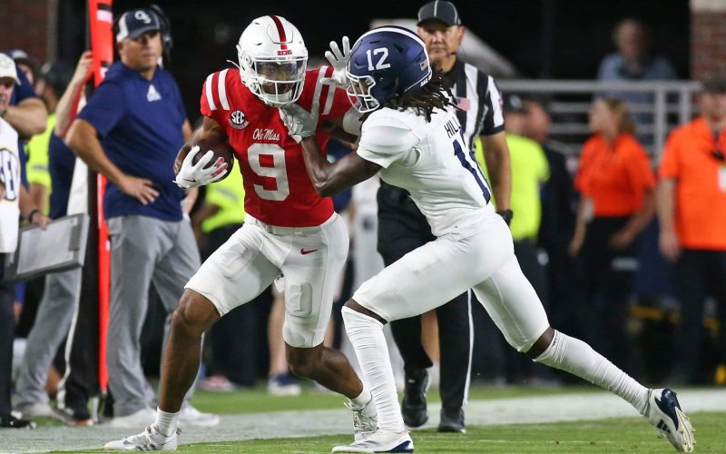 Sep 21, 2024; Oxford, Mississippi, USA; Mississippi Rebels wide receiver Tre Harris (9) runs after a catch as Georgia Southern Eagles defensive back Tracy Hill Jr. (12) pushes him out of bounds during the first half at Vaught-Hemingway Stadium. Mandatory Credit: Petre Thomas-Imagn Images