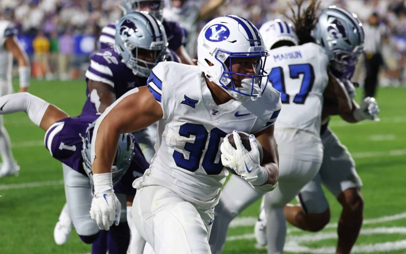 Sep 21, 2024; Provo, Utah, USA; Brigham Young Cougars running back Sione I Moa (30) runs for a touchdown against the Kansas State Wildcats during the fourth quarter at LaVell Edwards Stadium. Mandatory Credit: Rob Gray-Imagn Images