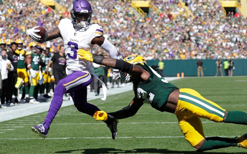 Minnesota Vikings wide receiver Jordan Addison (3) scores a touchdown run against Green Bay Packers defensive end Rashan Gary (52) in the second quarter during their football game Sunday, September 29, 2024, at Lambeau Field in Green Bay, Wisconsin.