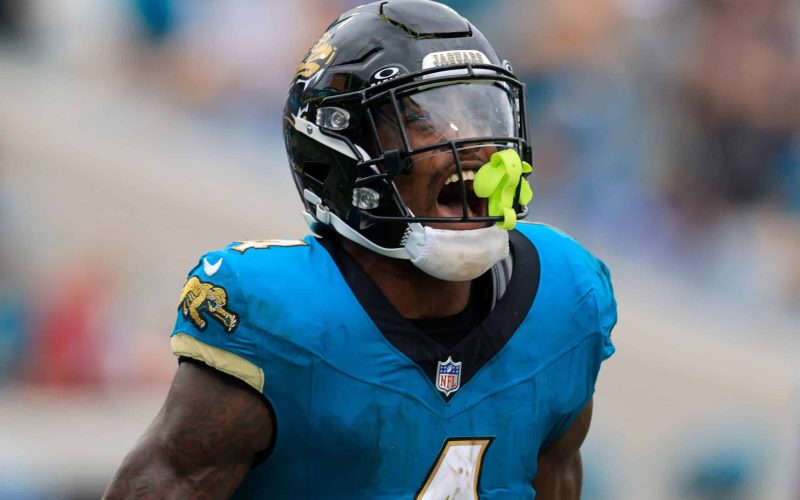 Jacksonville Jaguars running back Tank Bigsby (4) reacts to his touchdown during the third quarter of an NFL football matchup Sunday, Oct. 6, 2024 at EverBank Stadium in Jacksonville, Fla. The Jaguars edged the Colts on a field goal 37-34. [Corey Perrine/Florida Times-Union]