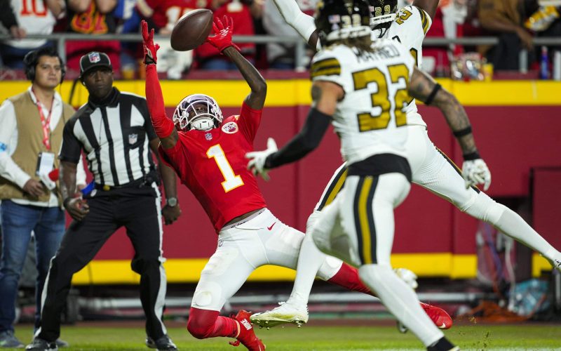 Oct 7, 2024; Kansas City, Missouri, USA; Kansas City Chiefs wide receiver Xavier Worthy (1) can’t make the catch against New Orleans Saints cornerback Paulson Adebo (29) and safety Tyrann Mathieu (32) during the second half at GEHA Field at Arrowhead Stadium. Mandatory Credit: Jay Biggerstaff-Imagn Images