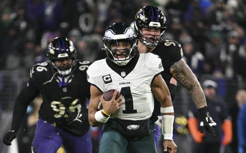 Dec 1, 2024; Baltimore, Maryland, USA; Philadelphia Eagles quarterback Jalen Hurts (1) rushes during the second  half  against the Baltimore Ravens at M&T Bank Stadium. Mandatory Credit: Tommy Gilligan-Imagn Images