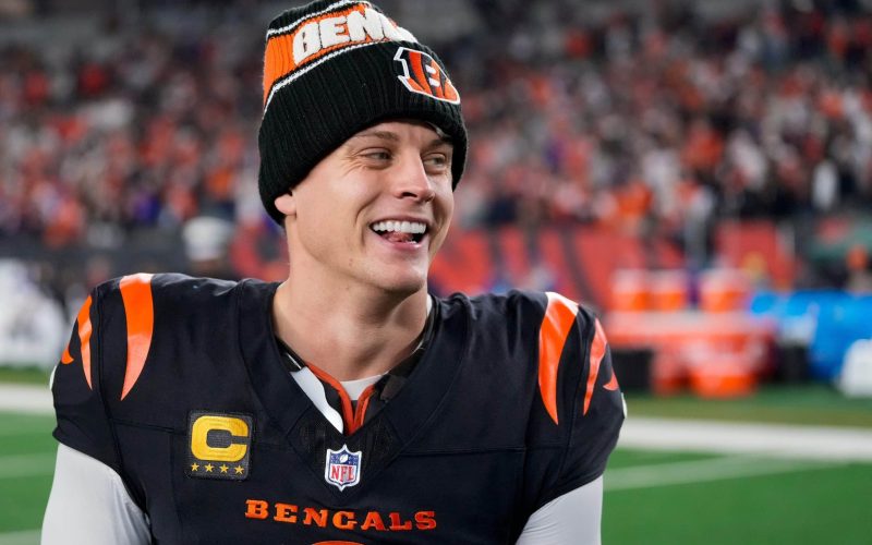 Bengals quarterback Joe Burrow celebrates a Week 17 overtime win over the Denver Broncos that kept Cincinnati\'s slim playoff hopes alive. Burrow threw for 412 yards and three touchdowns in the game and also added a rushing score.