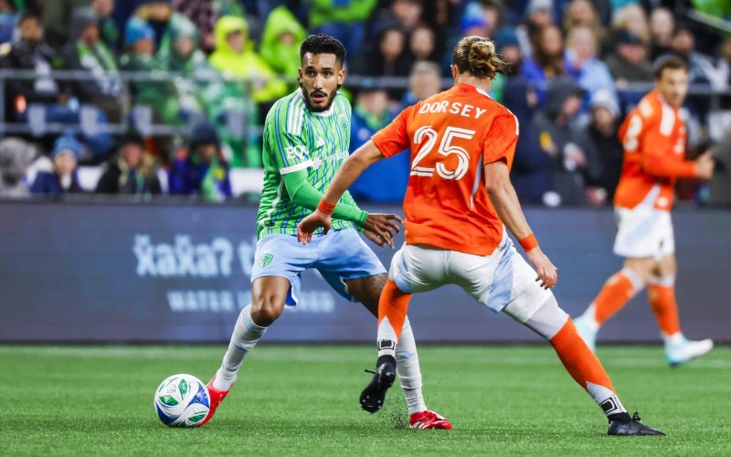 Mar 22, 2025; Seattle, Washington, USA; Seattle Sounders FC forward Jesus Ferreira (9) dribbles against the Houston Dynamo FC during the second half at Lumen Field. Mandatory Credit: Joe Nicholson-Imagn Images