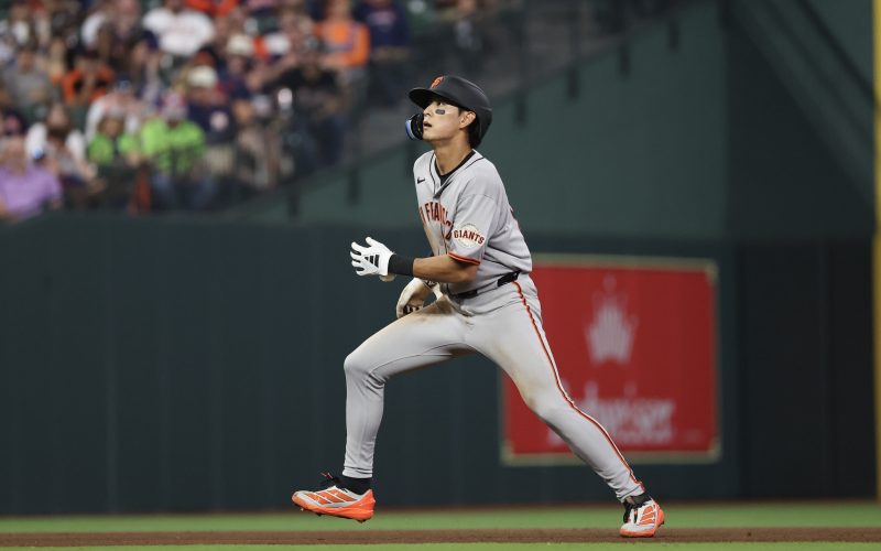Mar 31, 2025; Houston, Texas, USA; San Francisco Giants center fielder Jung Ho Lee (51) watches designated hitter Wilmer Flores (not pictured) three run home run clear the fence against the Houston Astros in the sixth inning at Daikin Park. Mandatory Credit: Thomas Shea-Imagn Images