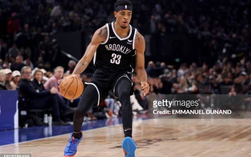 Brooklyn Nets\' US Center Nic Claxton runs with the ball during the NBA regular season basketball match between the Cleveland Cavaliers and the Brooklyn Nets at the Accor Arena in Paris on January 11, 2024. (Photo by Emmanuel Dunand / AFP) (Photo by EMMANUEL DUNAND/AFP via Getty Images)