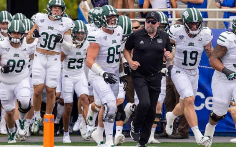 LEXINGTON, KENTUCKY - SEPTEMBER 21: Head coach Tim Albin of the Ohio Bobcats and team take the field before the game against the Kentucky Wildcats at Kroger Field on September 21, 2024 in Lexington, Kentucky. (Photo by Michael Hickey/Getty Images)