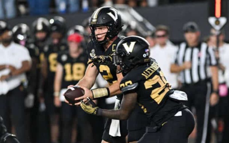 NASHVILLE, TENNESSEE - OCTOBER 5: Diego Pavia #2 hands the ball to Sedrick Alexander #28 of the Vanderbilt Commodores against the Alabama Crimson Tide in the second half at FirstBank Stadium on October 5, 2024 in Nashville, Tennessee. (Photo by Carly Mackler/Getty Images)